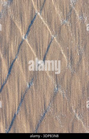 Sandy beach surface abstract textured pattern background Stock Photo