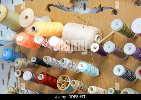 Sewing accessories on a wooden background, close-up. Stock Photo