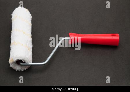 Painter roller for painting various surfaces Stock Photo