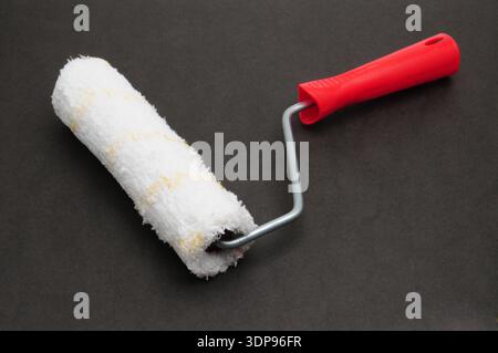 Painter roller for painting various surfaces Stock Photo