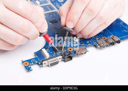 Laptop motherboard testing in service center Stock Photo