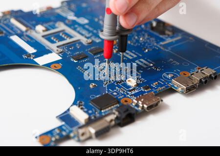 Laptop motherboard testing in service center Stock Photo