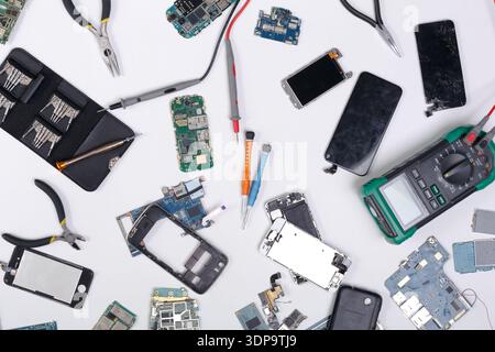 Repairing smartphone, dissasembling phone top view Stock Photo