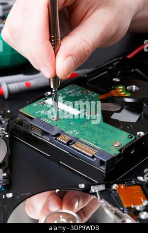 Hard disc drive disassembling close up Stock Photo