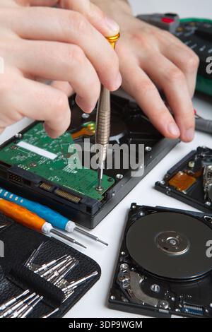 Hard disc drive disassembling close up Stock Photo