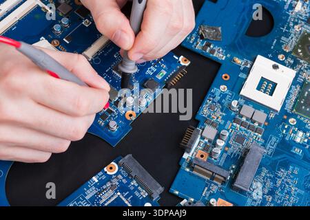 Laptop motherboard testing in service center Stock Photo