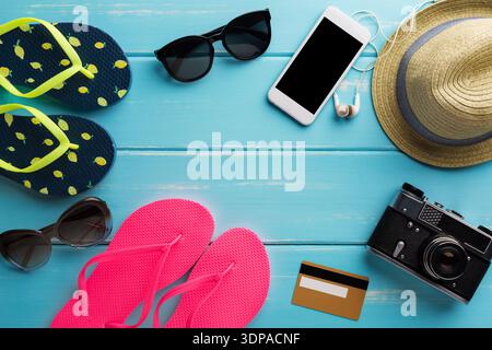 Vacation background on blue wood, online shopping on smartphone Stock Photo