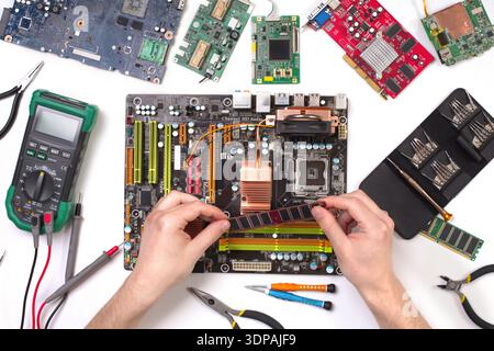 Technician upgrade of computer top view, motherboard Stock Photo