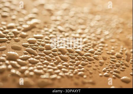 Macro view of water droplets forming a soft abstract texture with reflective highlights and shallow depth of field Stock Photo
