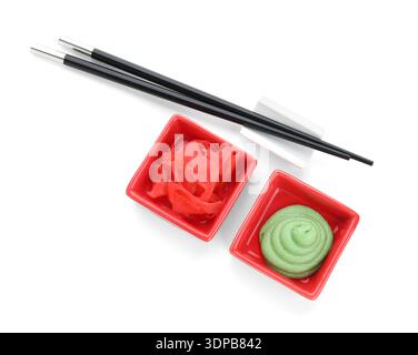 Bowls with wasabi and pickled ginger isolated on white background Stock Photo