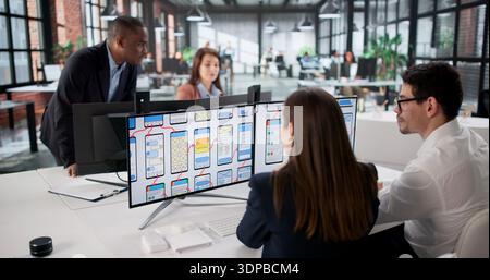 African American Man And Black Woman Design Website For Business. Stock Photo