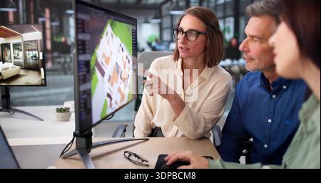 Senior Design Engineer And Real Estate Agent Collaborate On CAD Software Stock Photo