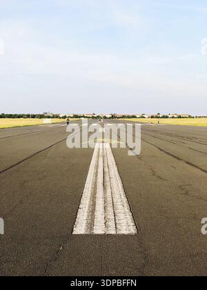 Painted arrow pointing forward on a former runway in Berlin, Germany, Berlin, Germany Stock Photo