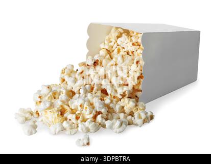 Popcorn falling out of cardboard bucket, isolated on white background Stock Photo