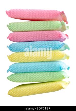 Yellow green blue and pink dish sponges in stack are isolated on white background with clipping path. Stock Photo