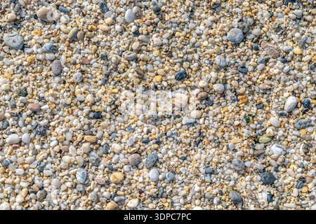 Top view close-up of natural colorful pebbles and coarse sand on Cleopatra Beach, Alanya. High-quality organic texture with copy space for text Stock Photo