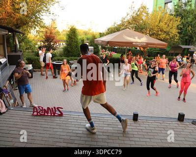 Zumba fitness instructor leading outdoor dance class in Severodonetsk Ukraine June 15 2021 Stock Photo