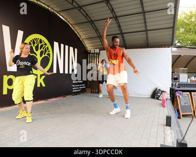 Zumba fitness instructor leading outdoor dance class in Severodonetsk Ukraine June 15 2021 Stock Photo