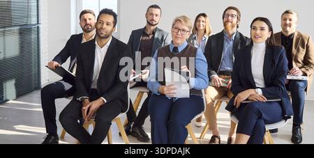 Diverse business team attending corporate meeting seminar workshop in modern office Stock Photo