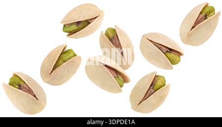 Falling pistachios isolated on white background, full depth of field Stock Photo