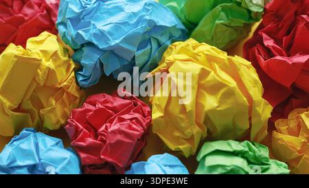 Colorful crumpled paper balls. Close up. Stock Photo