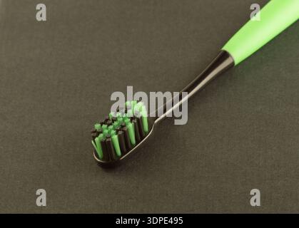 new modern toothbrush isolated on black solid background Stock Photo