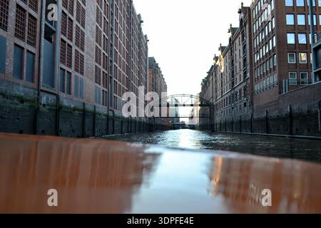Low angle view along canal between warehouses in Hamburg Stock Photo