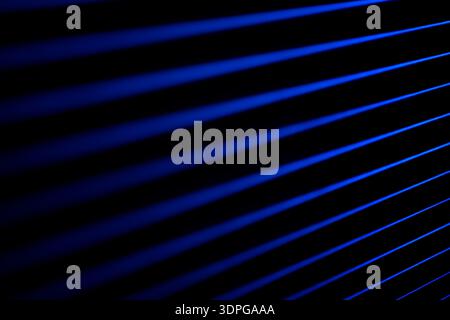 Blue neon light dissolves in darkness. Soft neon. Stock Photo