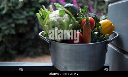 RWANDA, KIGALI. A variety of fresh vegetables,including broccoli, cauliflower, bell peppers, zucchini, tomatoes, and green onions on Nov 15,2025. Stock Photo