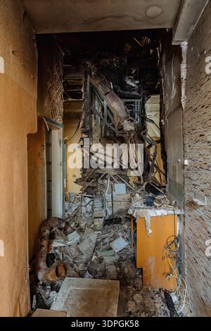 Aftermath of explosion and fire after attack. Burnt domestic room interior. Stock Photo