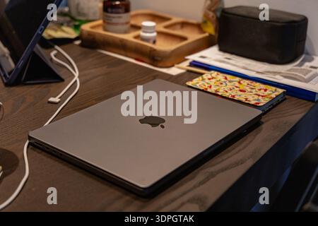 Closed Laptop Wooden Desk Near Accessories Stock Photo