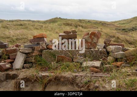 Stack of stone bricks as still life in the dune landscape Stock Photo