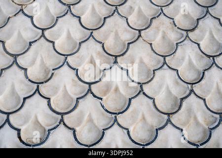Closeup detail view of mughal carved white marble slab and black onyx inlay in shape of water droplets in fountain, Shalimar gardens, Lahore, Pakistan Stock Photo