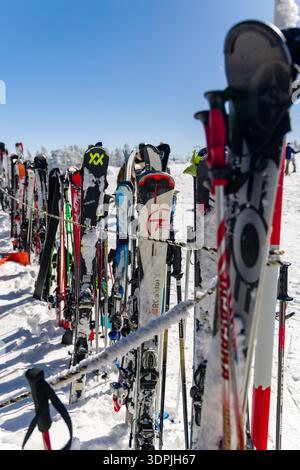 Snow In Athens Ski equipment. Skis and ski poles upright in fresh snow at scenic ski ...
