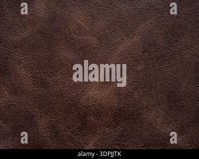Luxury brown, leather textured surface. Genuine quality empty pattern in dark red tone. Eco rough background. Backdrop blank skin effect for design Stock Photo