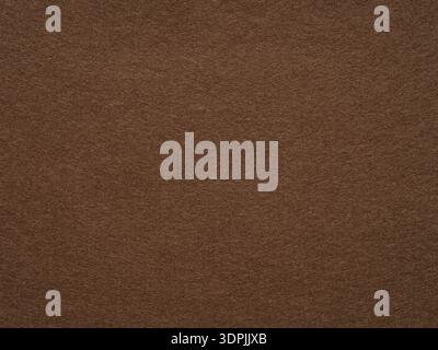 Dark brown felt, velvet texture. Soft background for text, lettering, patchwork or other art work. Full frame backdrop pattern wallpaper of art and Stock Photo