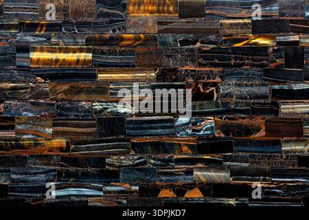 Tiger Eye Blue slab. Matt natural dark texture. Semiprecious, gemstone stone for ceramic wall, floor digital tiles. Material texture for unique Stock Photo