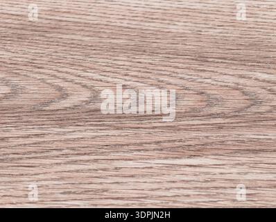 Light oak wood grain texture background featuring soft beige and tan tones with horizontal linear grain pattern and subtle natural detail. Stock Photo