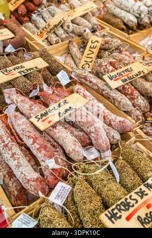 Rows of traditional French saucisson and dried meat sausages Stock Photo