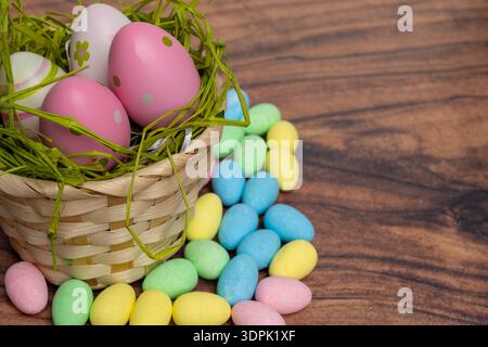 Vivid Easter Display Featuring Overflowing Basket And Treats On Wooden Surface Stock Photo