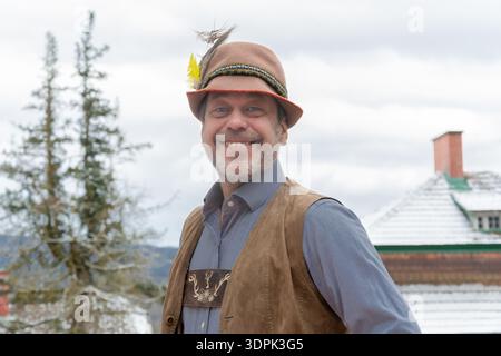 Portrait of man in Bavarian clothing in winter. Stock Photo