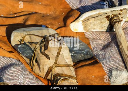 Flint ax and a bone club Stock Photo