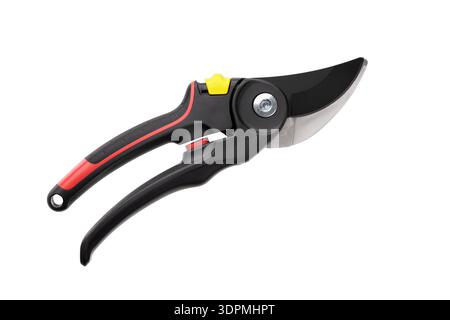 Professional garden pruner with black and red handles, sharp steel blade, and yellow safety lock isolated on a white background. Closed state. Top vie Stock Photo