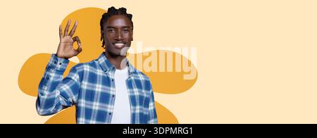 Young Man Gives a Hand Gesture While Smiling in a Simple Collage Setting Stock Photo