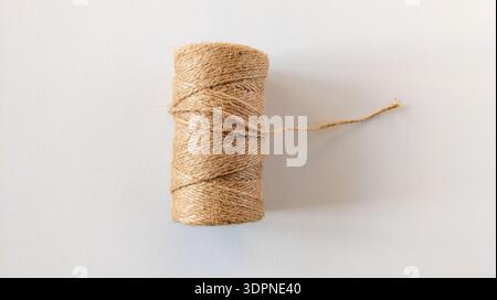 Skein of rope on a white background. Single thread. Jute rope. Roll of twine. Stock Photo