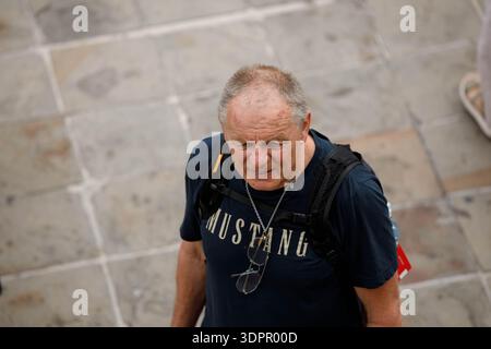 BANGKOK, THAILAND-JAN 21, 2026: Senior male tourist exploring Wat Arun, high angle view Stock Photo
