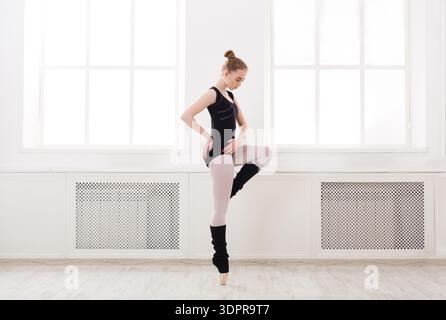 Ballet Dancer Practices in a Bright Studio During the Afternoon Stock Photo