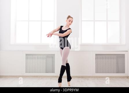 Ballet Dancer Performs in Studio With Large Windows and Natural Light During Daytime Stock Photo