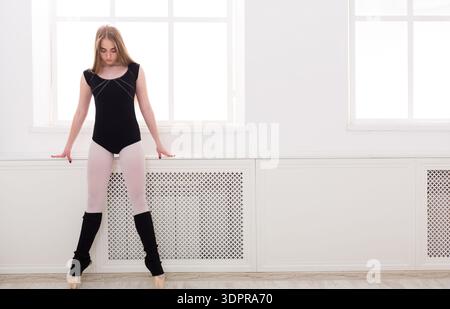 Dancer Practicing in a Studio With Natural Light During the Day Stock Photo