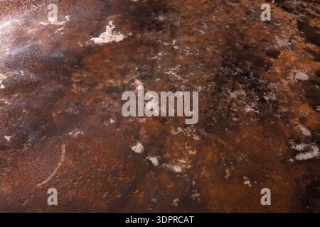 Rusty Metal Surface Shows Various Textures and Patterns in Different Shades of Brown and Gray Stock Photo